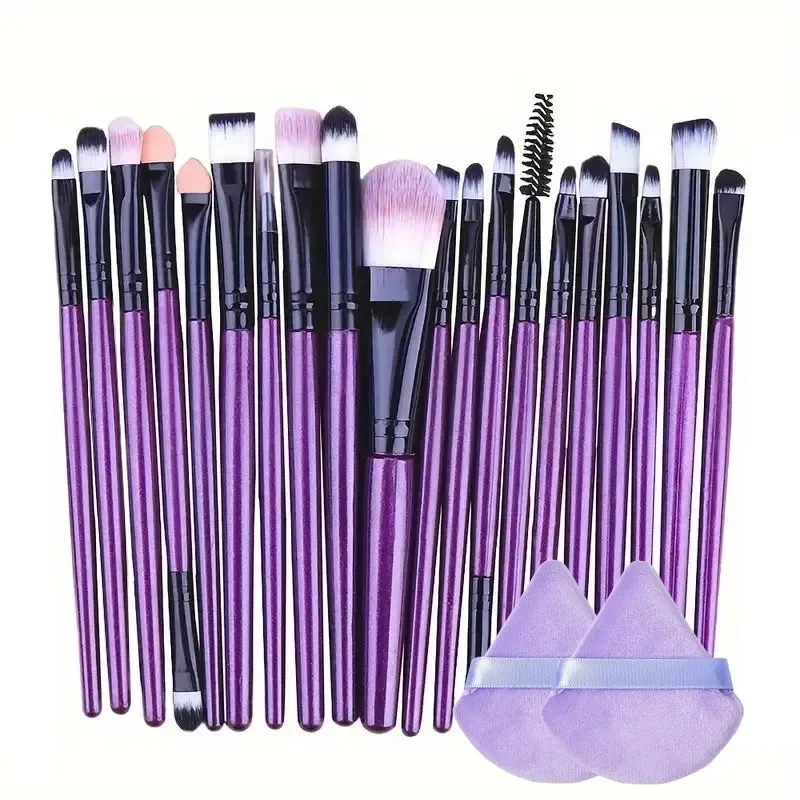 A set of purple makeup brushes and sponges arranged neatly against a white background.