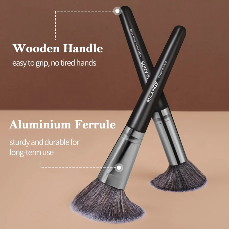 Two makeup brushes with wooden handles and aluminum ferrules. Close-up view highlighting the design features.