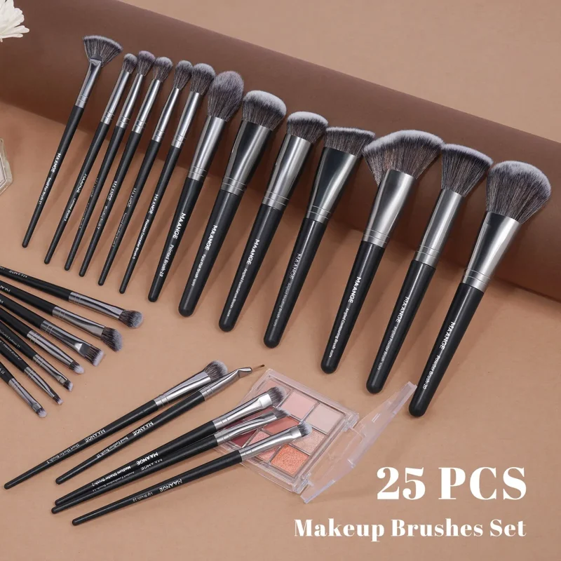 25-piece makeup brush set with a variety of brush shapes and sizes, including powder brushes, foundation brushes, concealer brushes, and eyeshadow brushes. The brushes have black handles with silver ferrules and soft, synthetic bristles. A small eyeshadow palette is also included in the image.