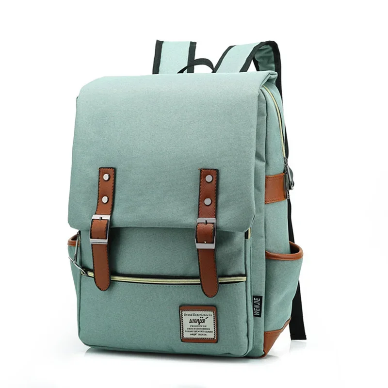 A light teal backpack with brown leather accents sits on a white background.