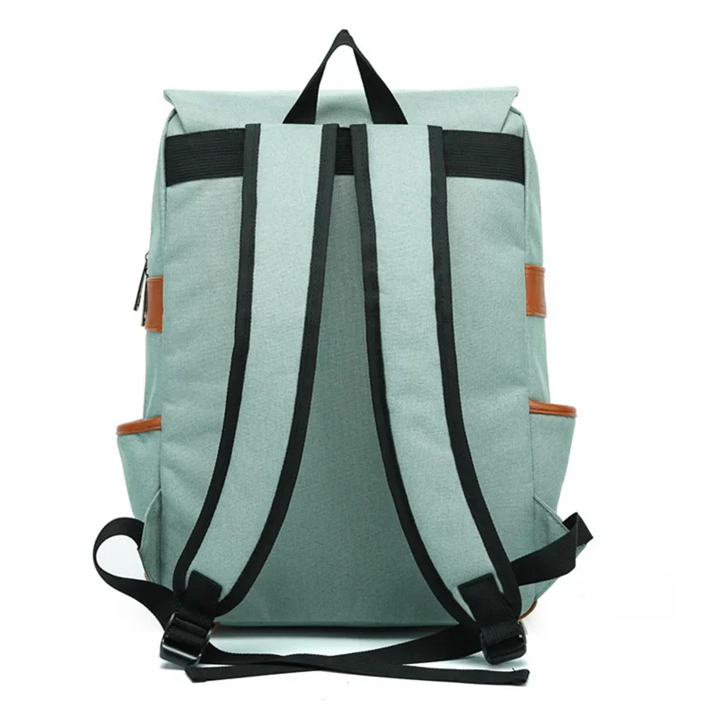 Back view of a light green canvas backpack with brown leather accents and black straps.
