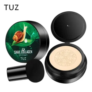 A close-up shot of a TUZ Snail Collagen CC Cream cushion compact. The compact is black with a green and white label featuring a snail. A black sponge applicator is included.