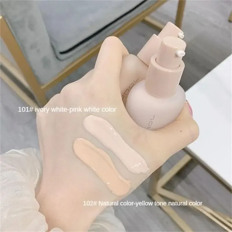 Two shades of foundation are swatched on a hand. The foundation comes in a pump bottle. The shades are 101# ivory white-pink white color and 102# Natural color-yellow tone natural color.