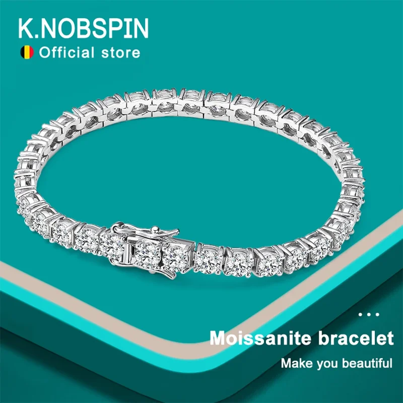 A stunning moissanite tennis bracelet on a teal background. The bracelet is made of white gold and features round-cut moissanite stones.