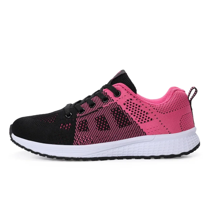 A single pink and black sneaker is shown from the side, set against a white background.