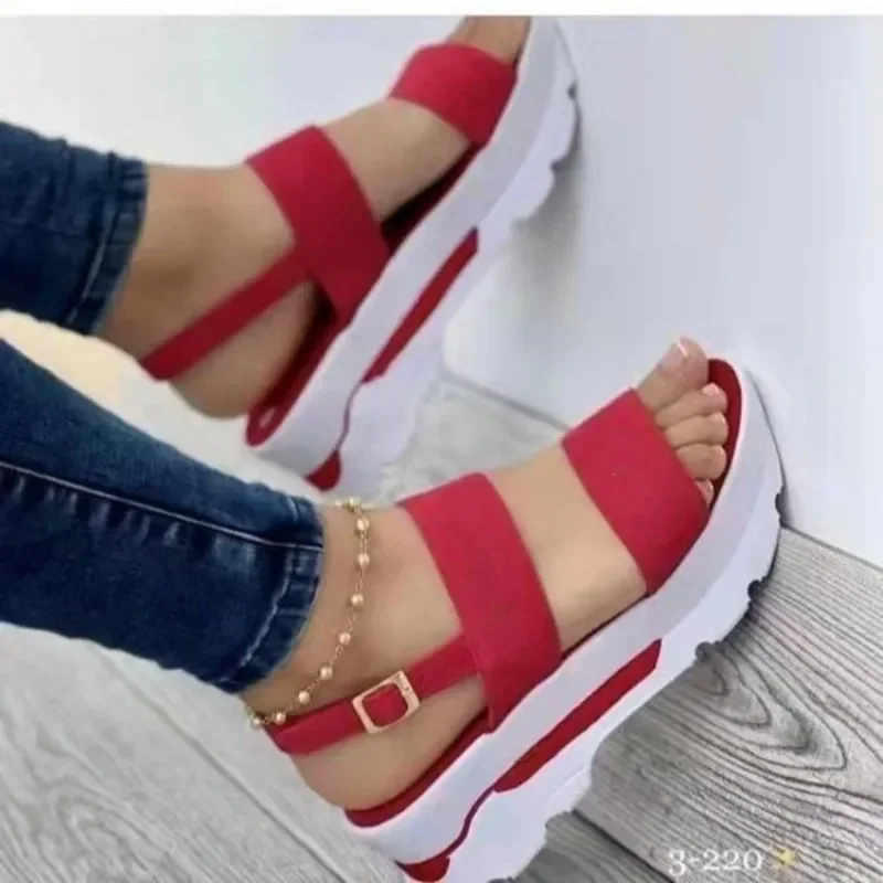 A pair of red and white platform sandals.