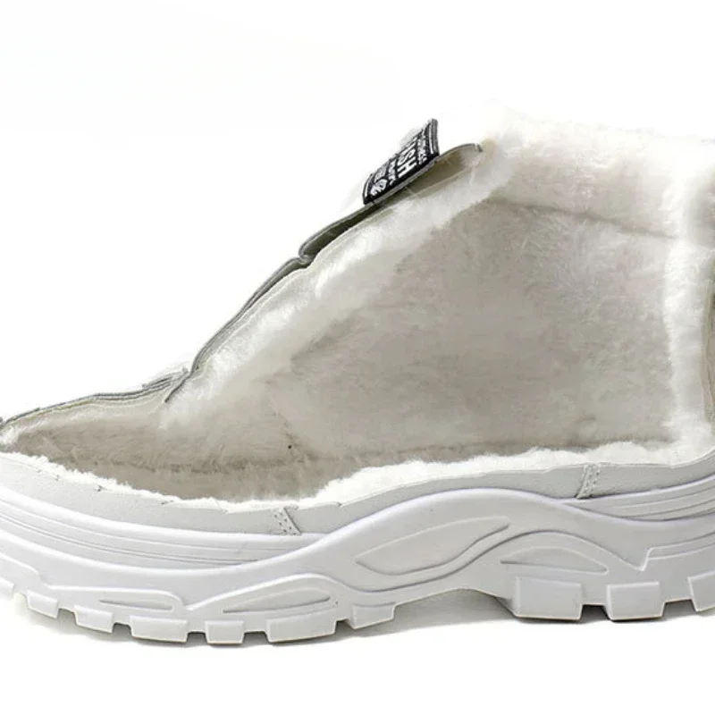 Close-up view of a white chunky sneaker with a fluffy, faux fur lining. The shoe is cut open to reveal the interior lining.