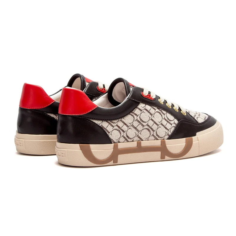 A pair of Ferragamo sneakers in black and beige with red accents. The sneakers are low-top and have a casual design. They are made of leather and canvas. The Ferragamo logo is visible on the tongue and heel.