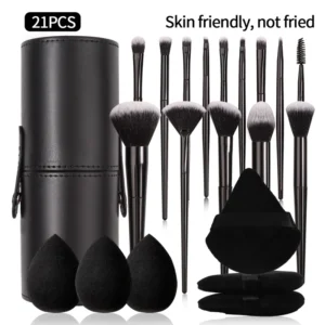 A set of 21 black makeup brushes and sponges in a black leather case.