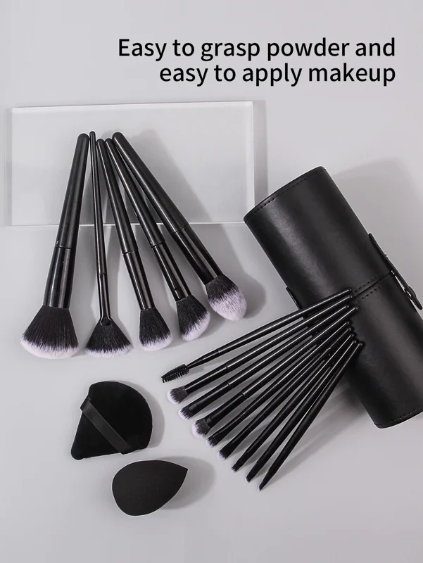 A set of black makeup brushes in a black case. The brushes are arranged in a way that shows off their different shapes and sizes. The case is made of leather and has a snap closure. The brushes are easy to grasp powder and easy to apply makeup.