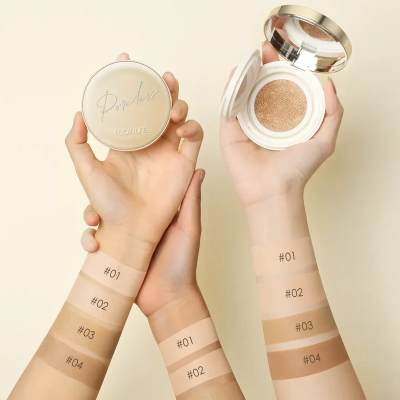 Two hands displaying swatches of four different shades of Poreless foundation by FOCALLURE.