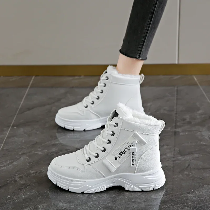 A pair of white high-top sneakers with a fur lining. The sneakers are worn by a person whose legs are visible in the image.