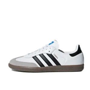A white Adidas Samba shoe with black stripes and a gum sole.